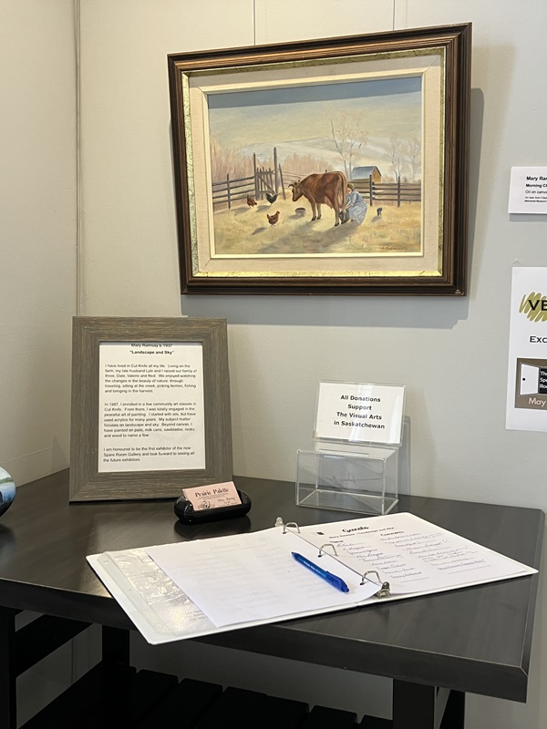Gallery table with guest book, artist bio, etc